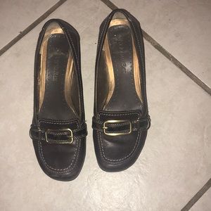 A set pair of brown shoes